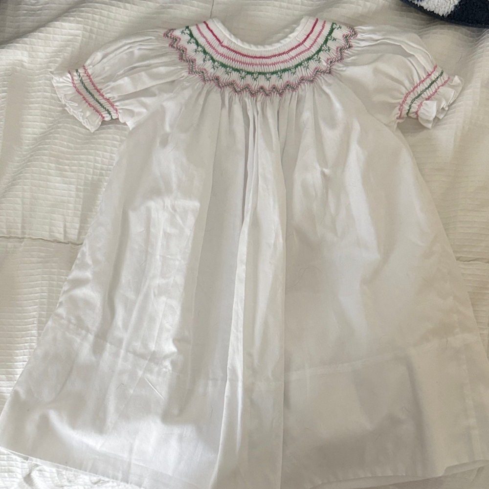 White smart dress with pink and green detail